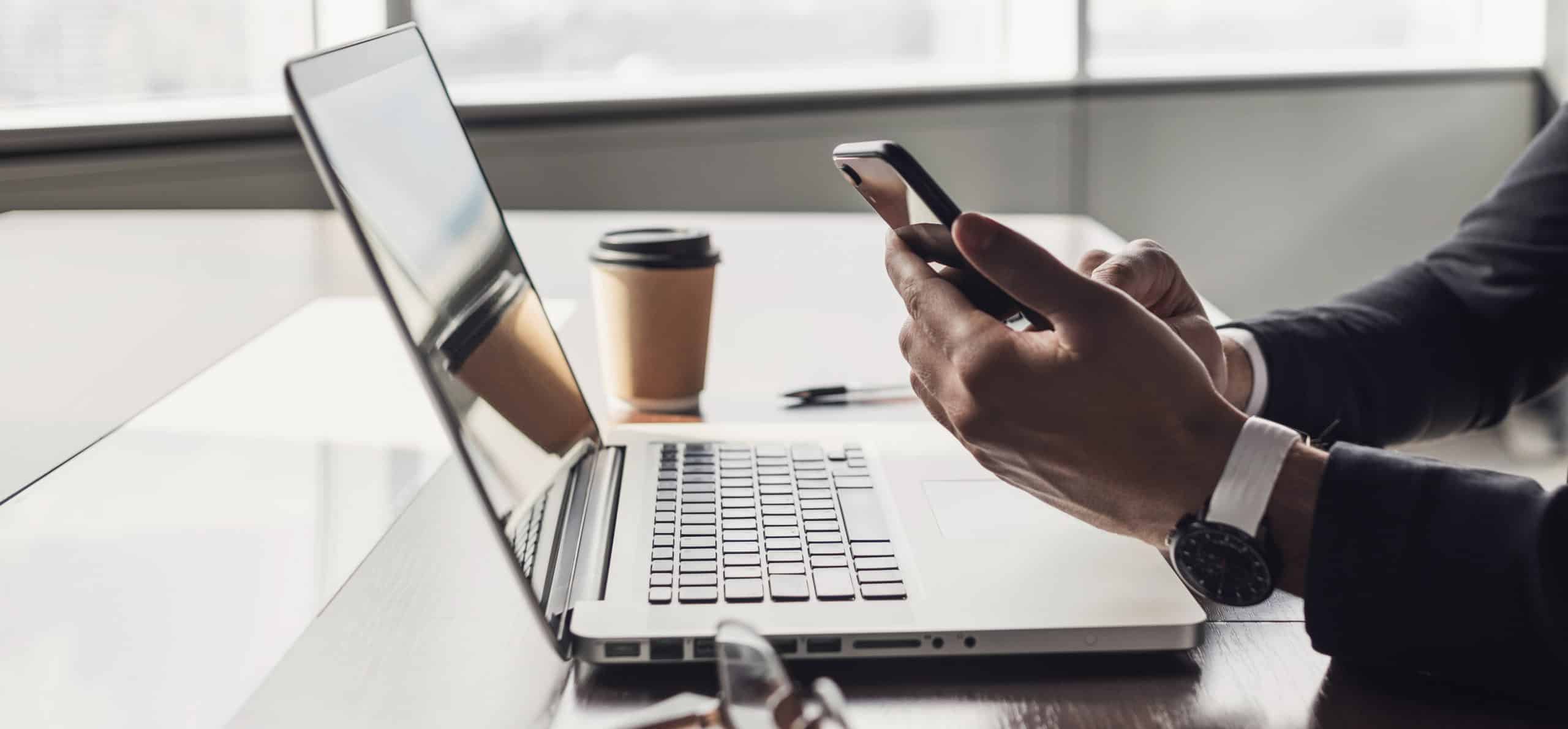 Man using smartphone, banner, businessman or manager using laptop computer, working in office, internet marketing, office workplace, white collar worker, entrepreneur concept
